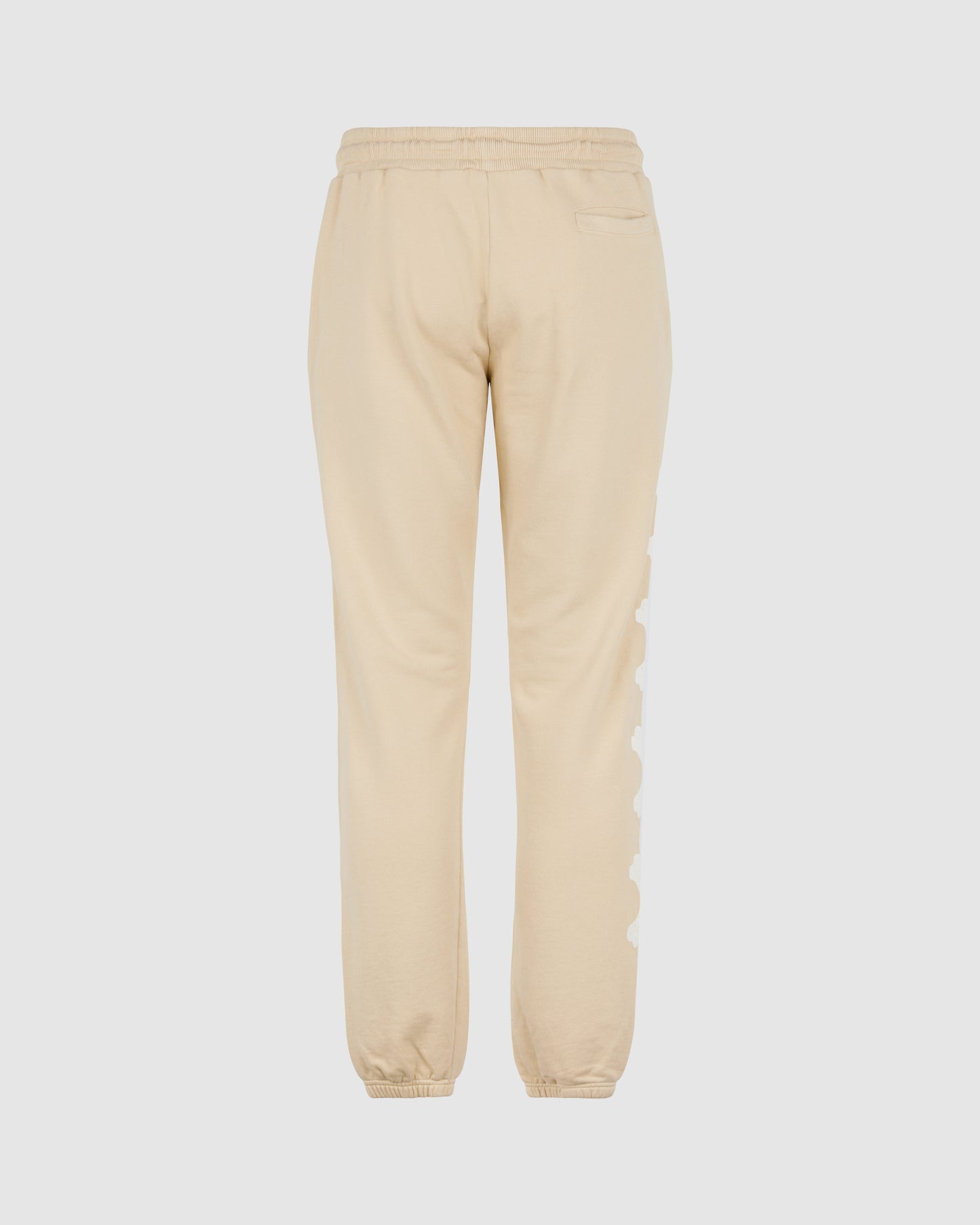 BEIGE PANTS WITH WHITE CROSS BONES